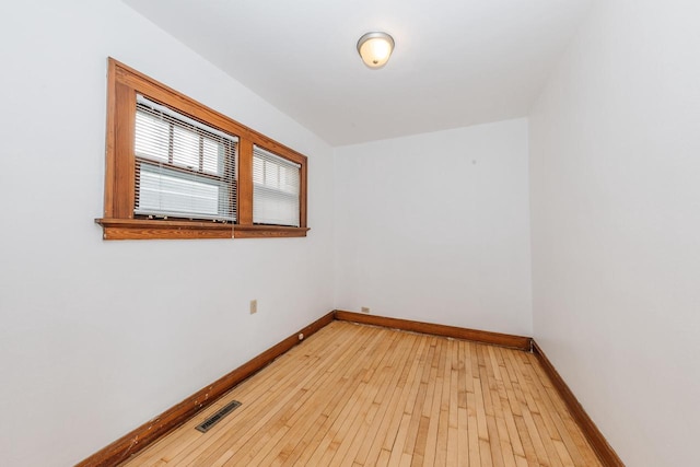 unfurnished room with light wood-type flooring