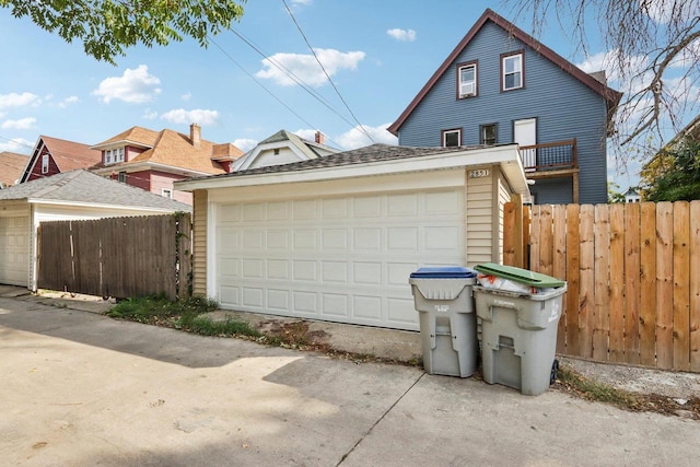 exterior space with an outbuilding and a garage