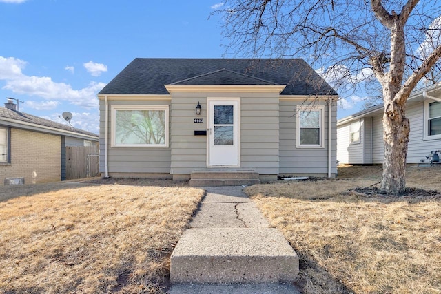 bungalow with a front yard