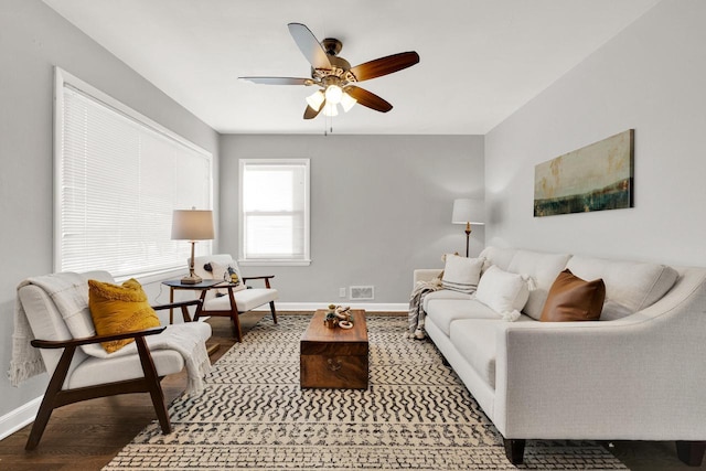 living room with hardwood / wood-style flooring and ceiling fan