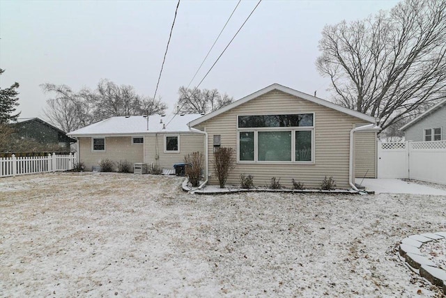 rear view of property featuring central AC unit