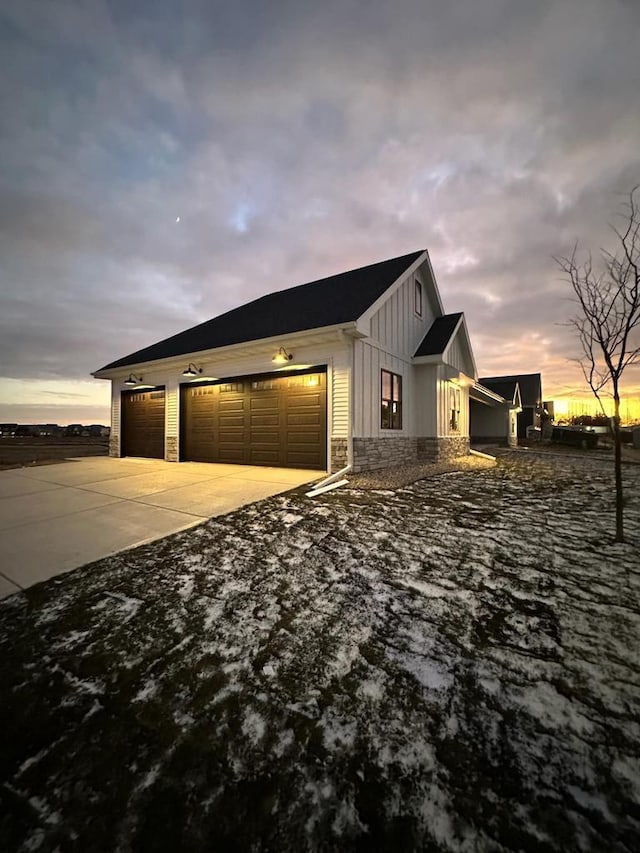 property exterior at dusk with a garage