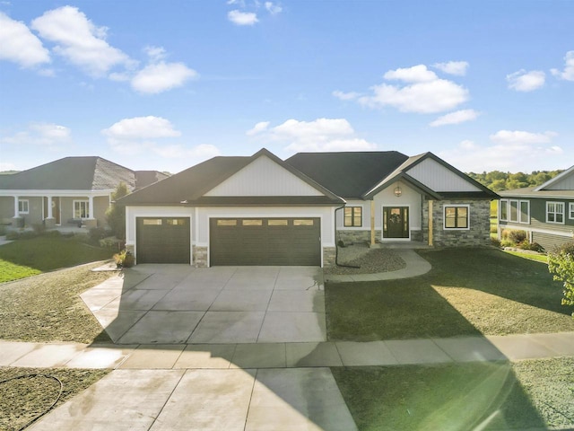 view of front of property with a garage and a front lawn