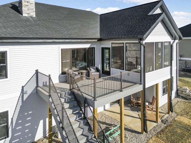 822 Westbridge Trl, Waunakee, WI 53597 - rear view of house featuring a sunroom and a patio