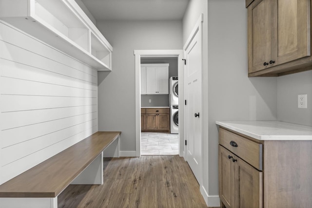 822 Westbridge Trl, Waunakee, WI 53597 - mudroom featuring stacked washer / drying machine and light wood-type flooring