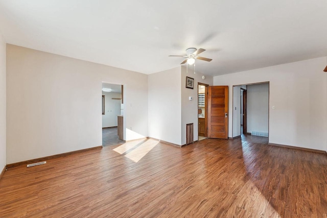 empty room with ceiling fan and wood-type flooring