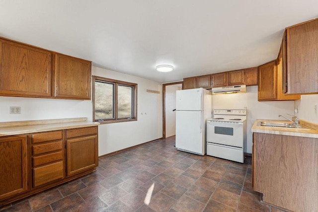 kitchen featuring white appliances and sink