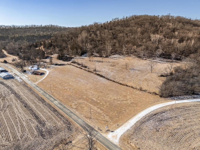 birds eye view of property with a rural view