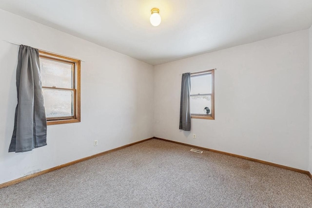 unfurnished room featuring carpet flooring