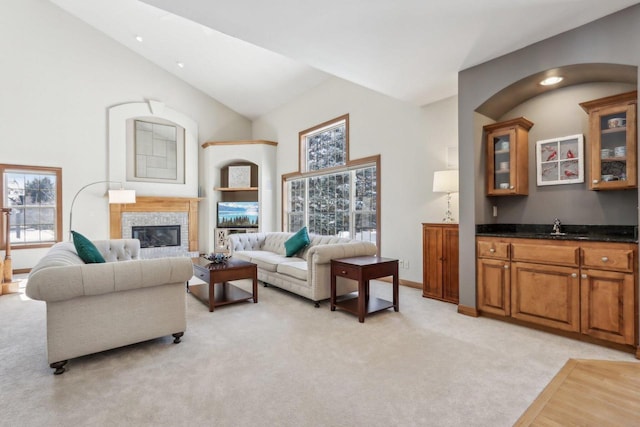 N33W29204 Millridge Rd, Pewaukee, WI 53072 - carpeted living room with a healthy amount of sunlight, high vaulted ceiling, and sink