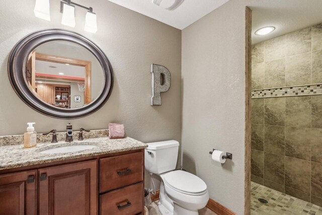 N33W29204 Millridge Rd, Pewaukee, WI 53072 - bathroom featuring toilet, tiled shower, and vanity