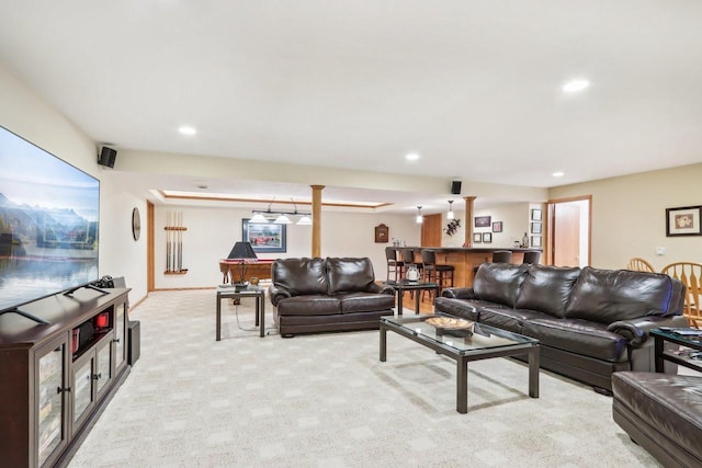 living room with light colored carpet and bar area