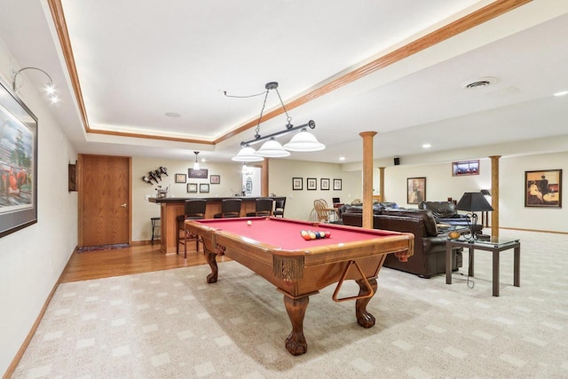 recreation room with decorative columns, bar area, pool table, light colored carpet, and a raised ceiling