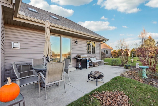 view of patio / terrace with a grill and an outdoor fire pit