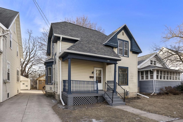 view of front facade featuring covered porch and a sunroom