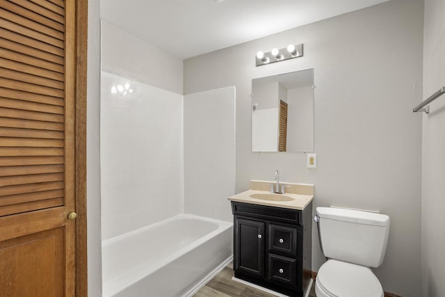 full bathroom featuring bathtub / shower combination, vanity, toilet, and wood-type flooring