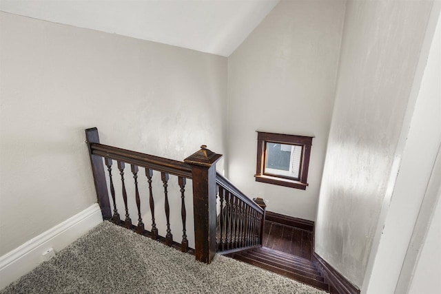 stairs with vaulted ceiling