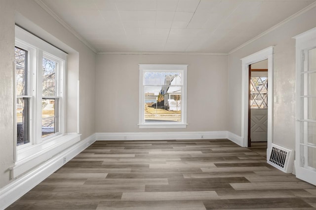 unfurnished dining area with crown molding, hardwood / wood-style floors, and a wealth of natural light