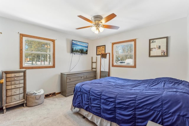 bedroom featuring ceiling fan and light colored carpet