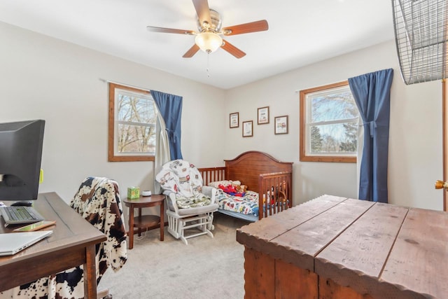 bedroom with multiple windows, carpet floors, and ceiling fan