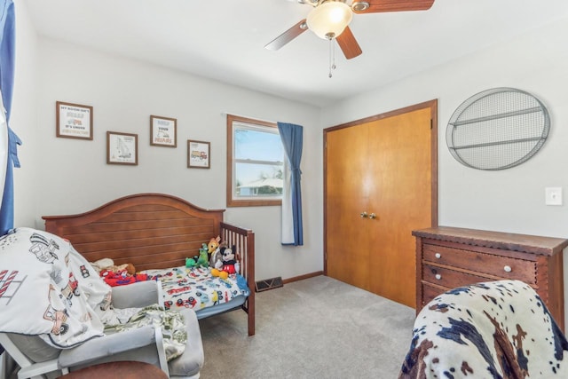 bedroom featuring ceiling fan and light colored carpet