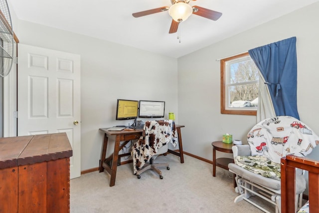 home office with light carpet and ceiling fan