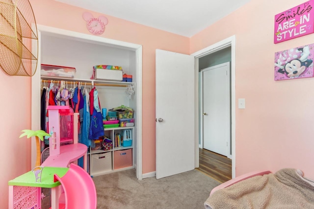 bedroom with a closet and carpet