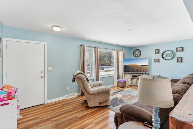 living room with light hardwood / wood-style floors