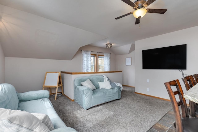 living room featuring ceiling fan and lofted ceiling