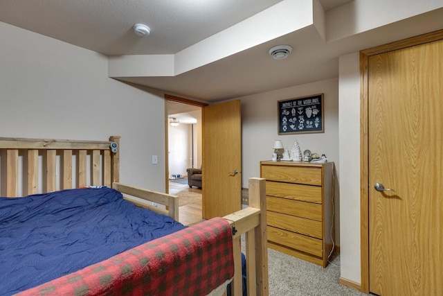 bedroom featuring light colored carpet