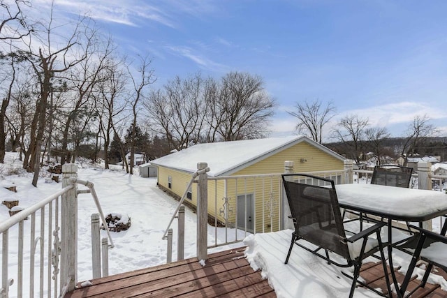 view of snow covered deck