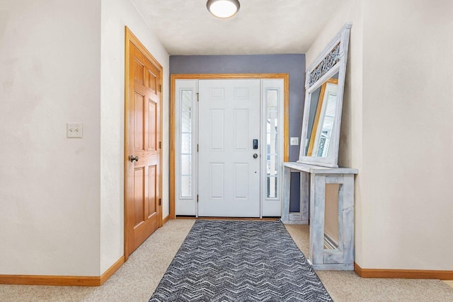 view of carpeted foyer