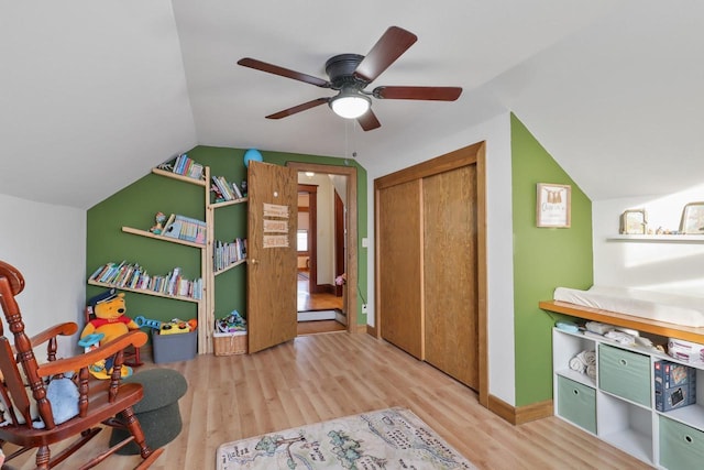 rec room featuring lofted ceiling, ceiling fan, and light hardwood / wood-style flooring