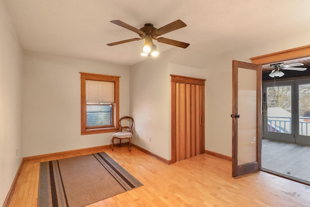 spare room with french doors, ceiling fan, and light hardwood / wood-style floors