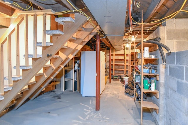 basement featuring white refrigerator