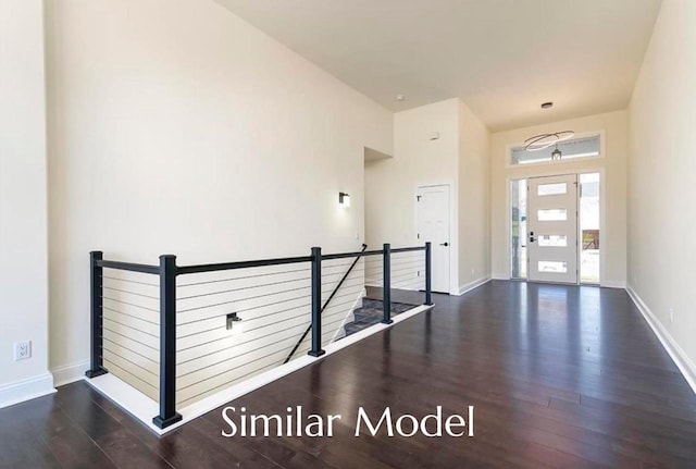 foyer entrance with dark wood-type flooring