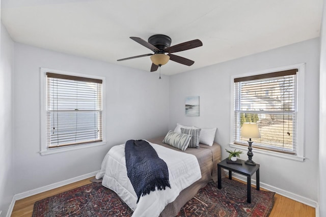 bedroom featuring hardwood / wood-style flooring and ceiling fan