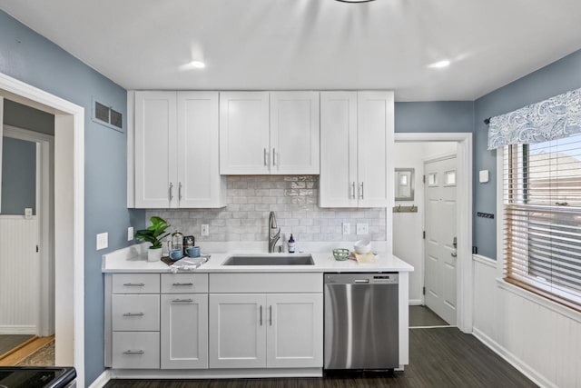 kitchen featuring white cabinetry, sink, dark hardwood / wood-style flooring, and stainless steel dishwasher