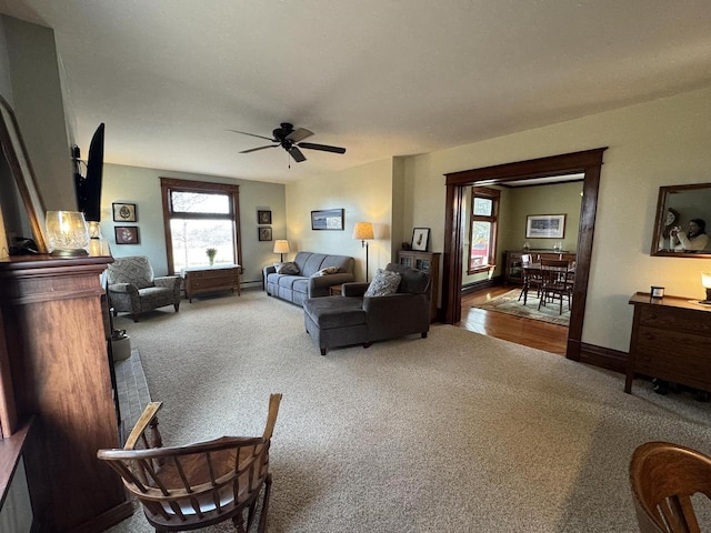 living room featuring ceiling fan and carpet floors