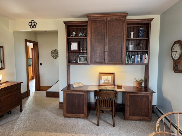 carpeted office space featuring baseboard heating