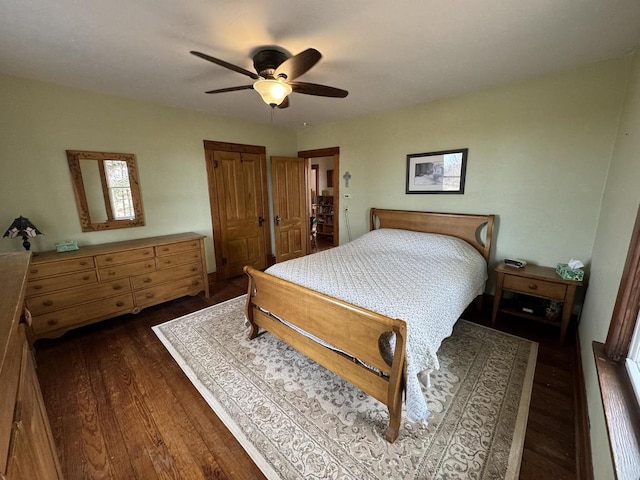 bedroom featuring ceiling fan and dark hardwood / wood-style flooring