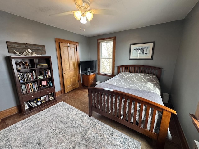 bedroom with hardwood / wood-style floors and ceiling fan