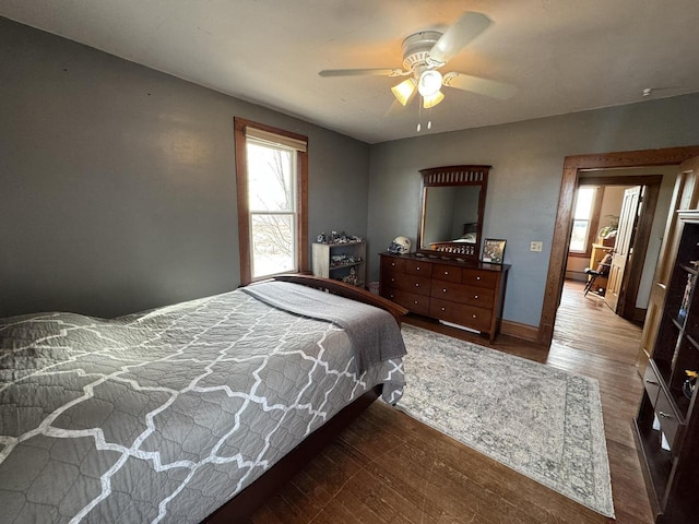 bedroom with hardwood / wood-style flooring and ceiling fan