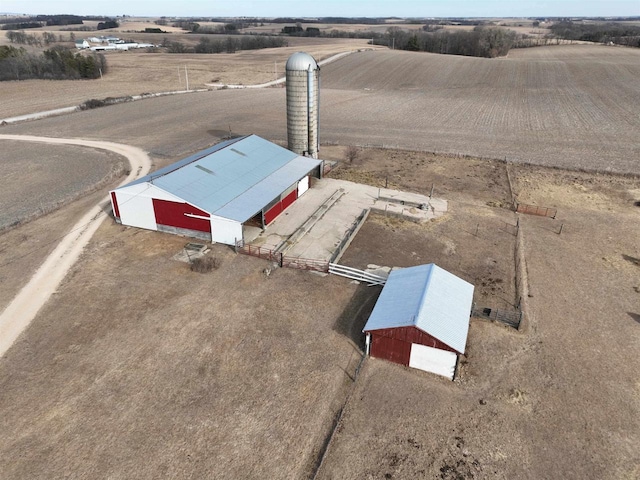 birds eye view of property with a rural view