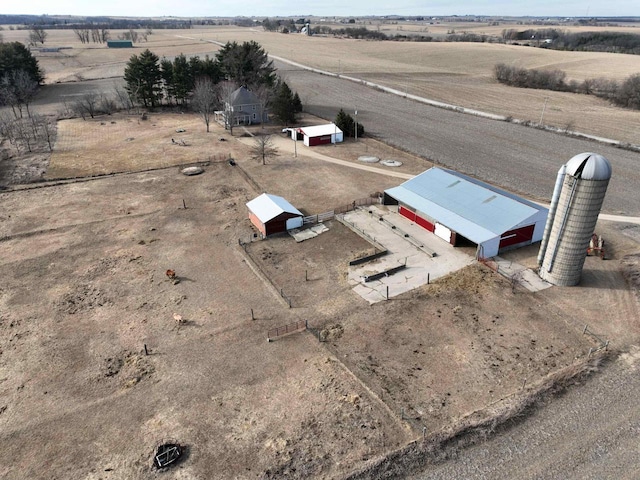 birds eye view of property with a rural view