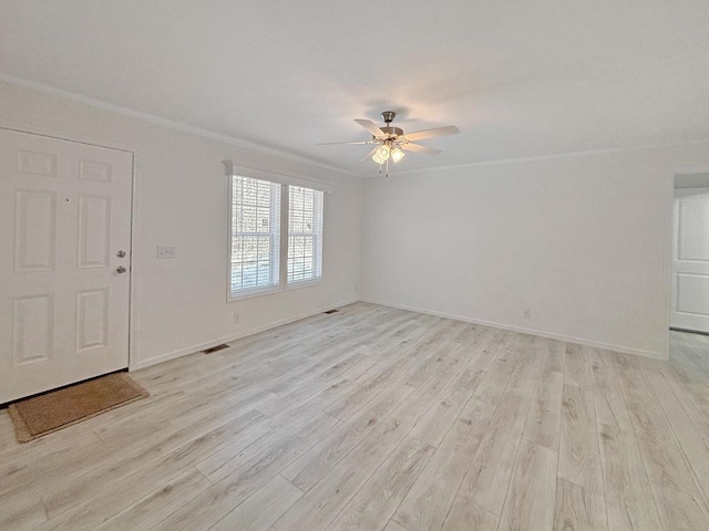 interior space featuring ceiling fan, ornamental molding, and light hardwood / wood-style floors