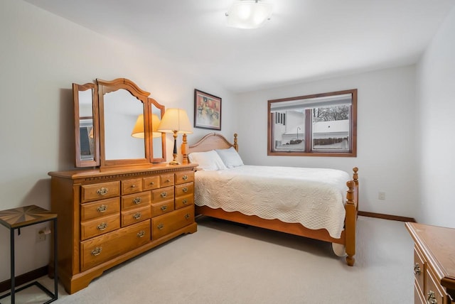 bedroom featuring light carpet