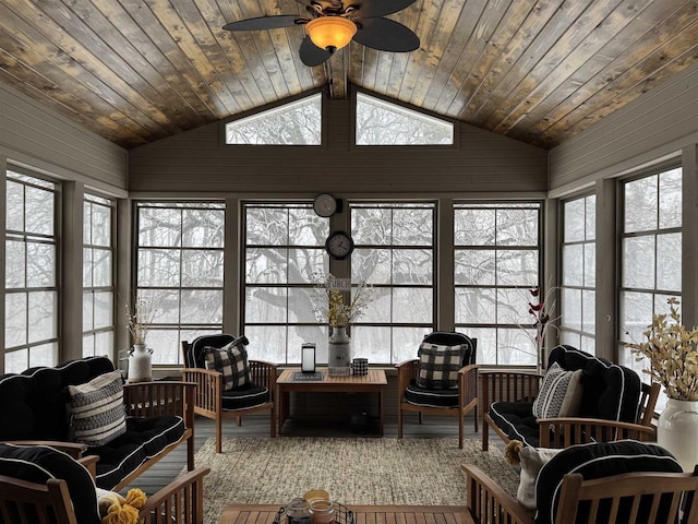 sunroom with a wealth of natural light, wood ceiling, and vaulted ceiling