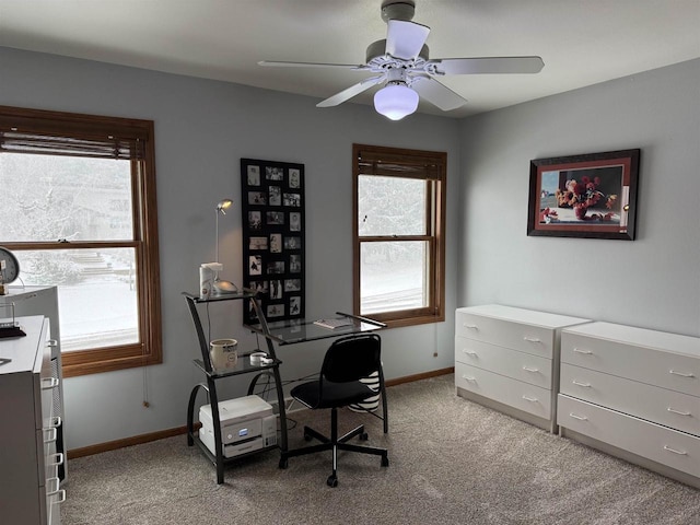 office with light carpet, ceiling fan, and baseboards