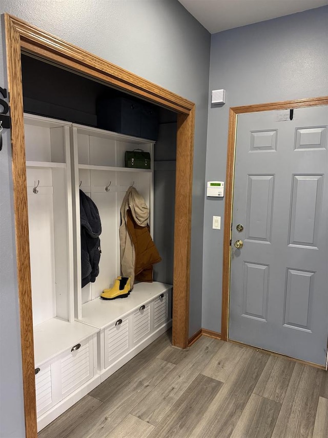 mudroom with light wood-type flooring and baseboards